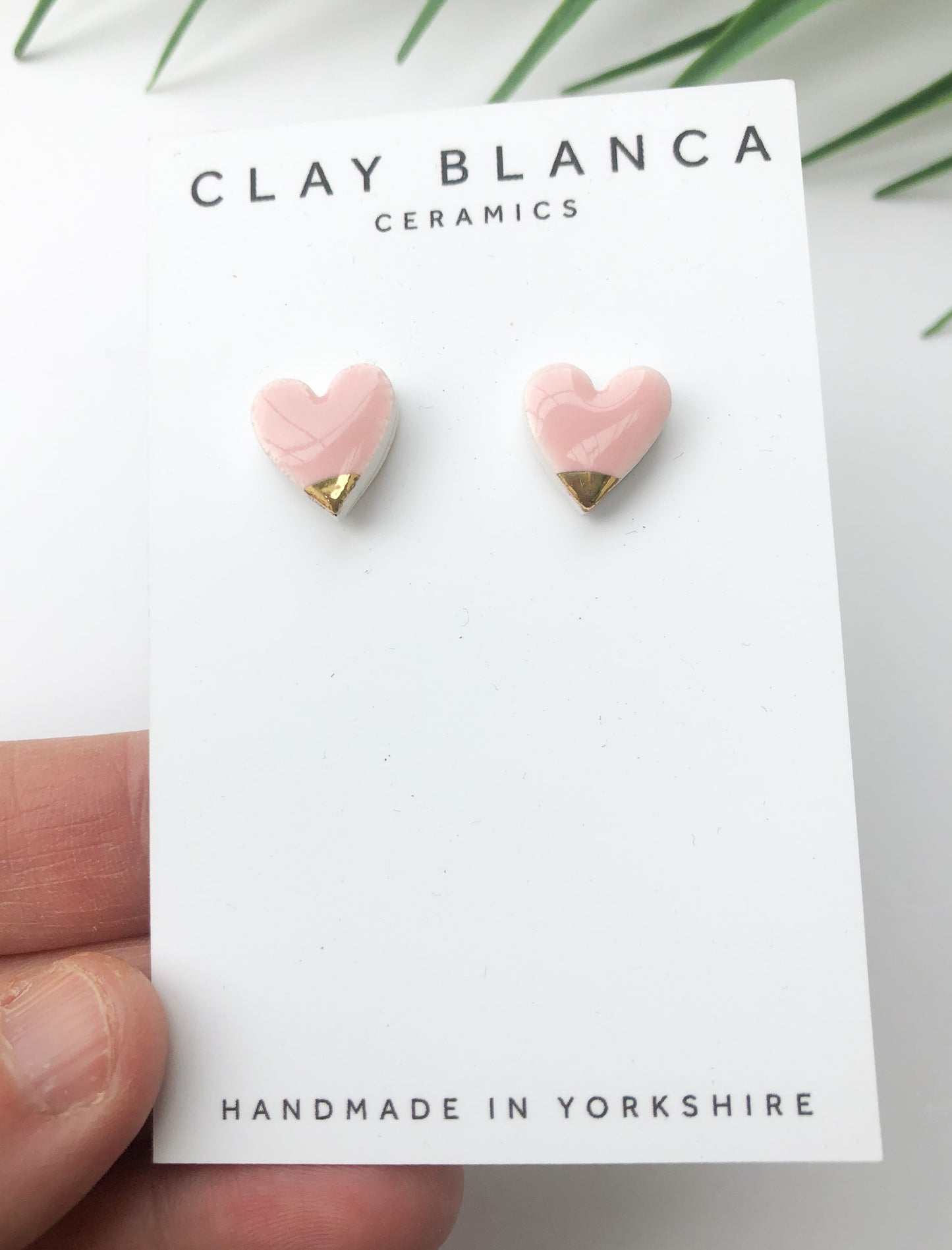 pink clay heart earrings with gold tips on silver plated backs