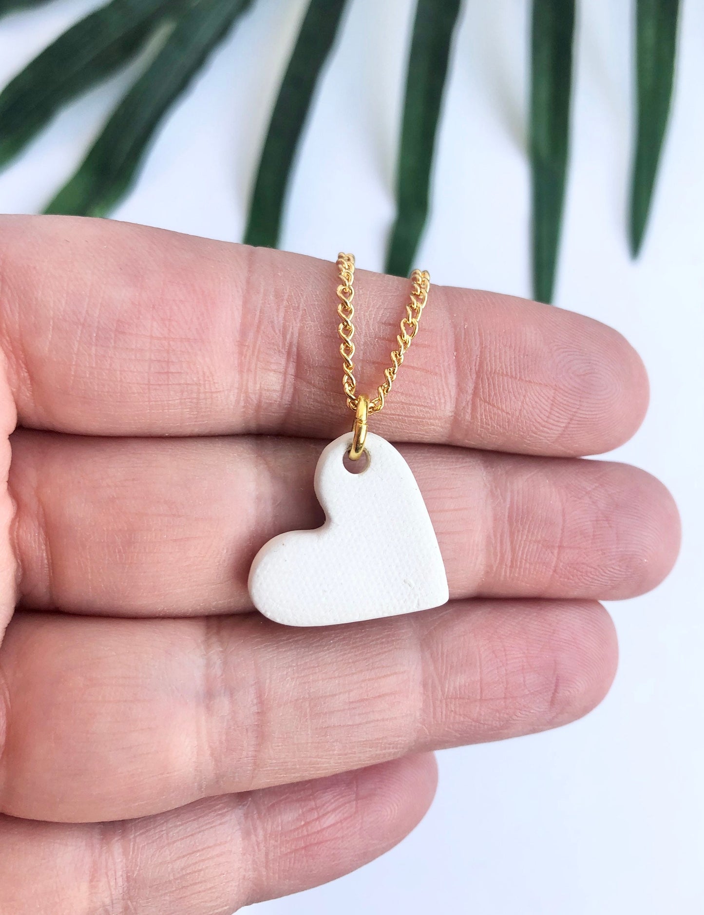 White small heart necklace with gold tip