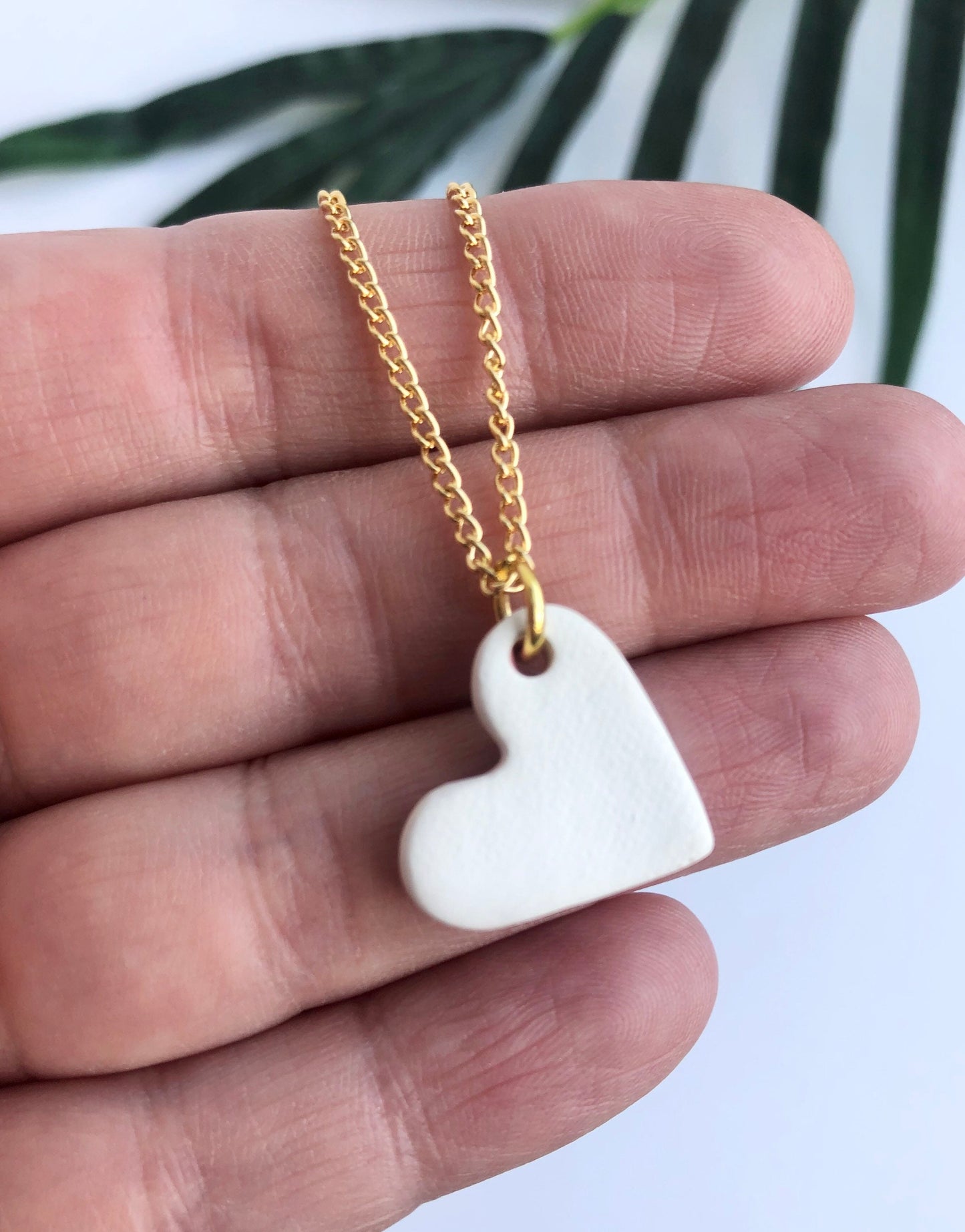 Pink small heart necklace with a gold tip