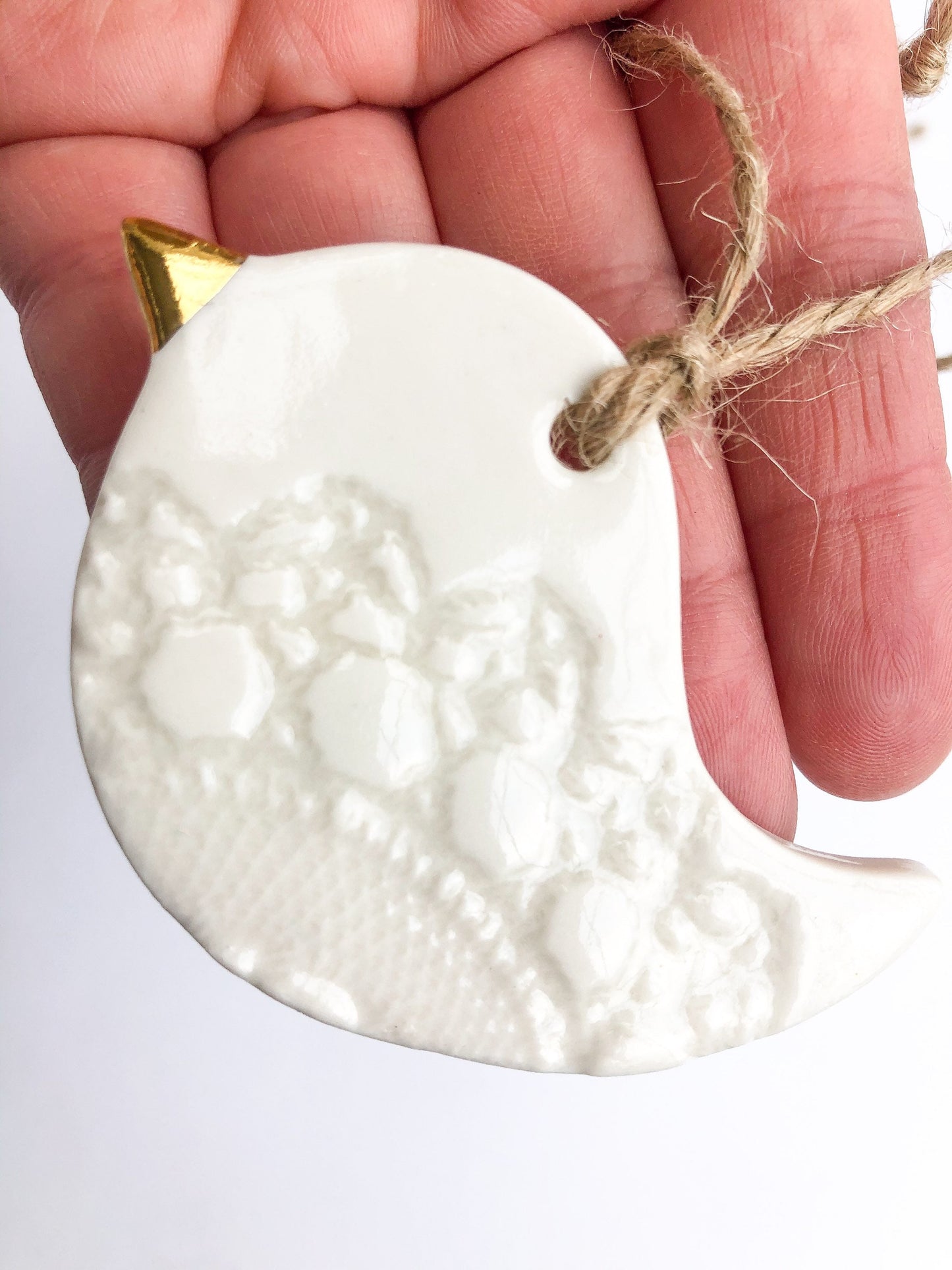 White bird with lace imprint ornament