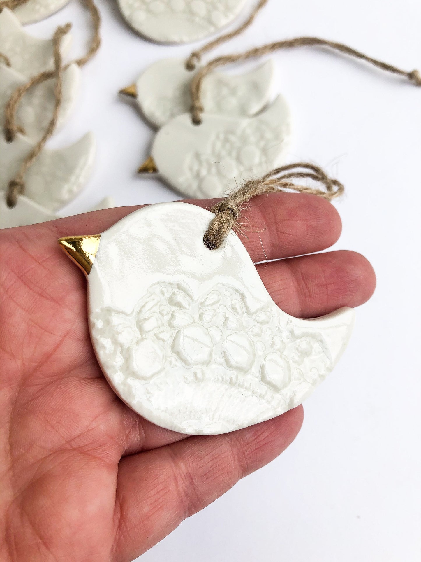 White bird with lace imprint ornament