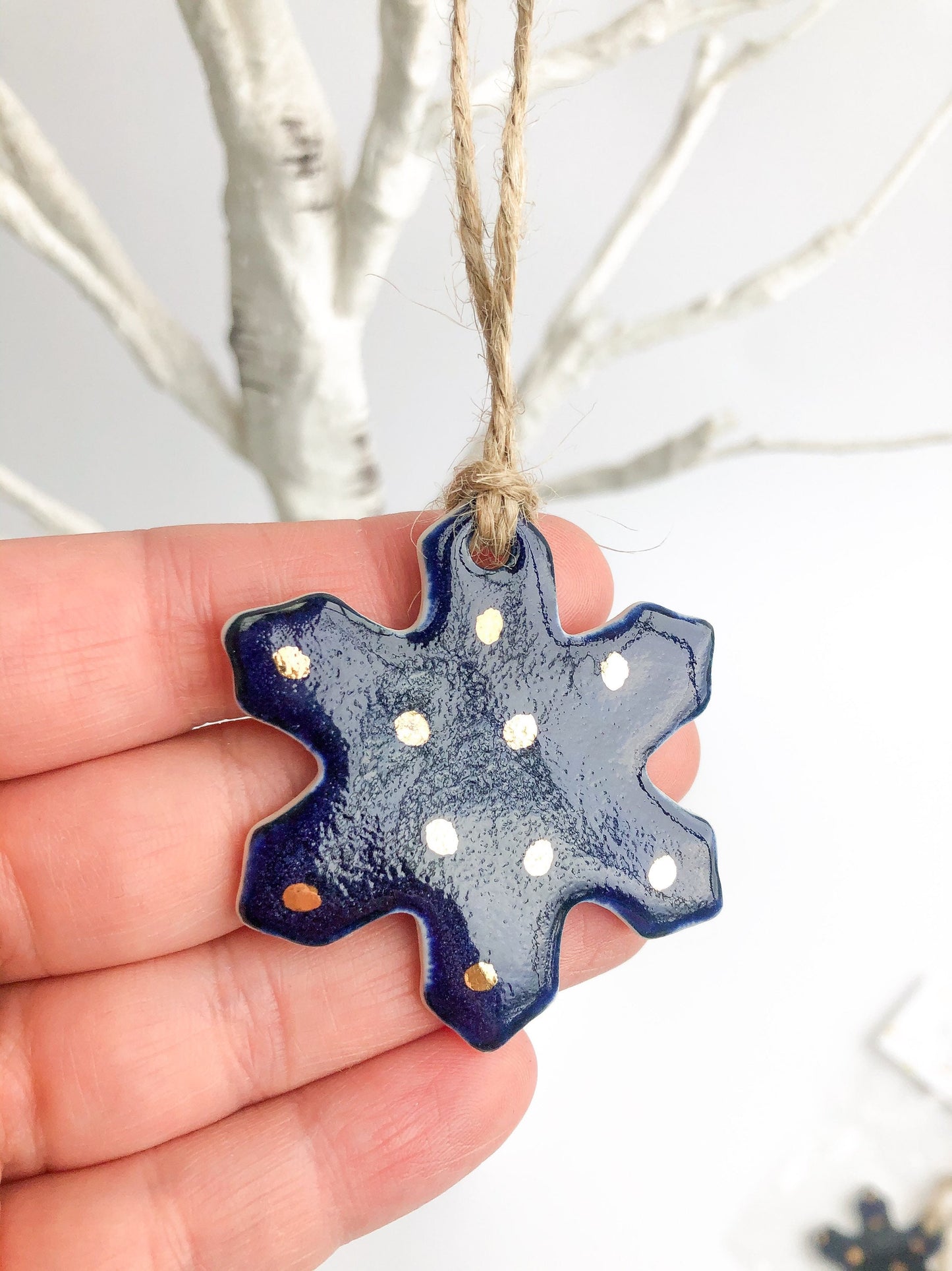 Ultramarine snowflake gift tag with gold dots