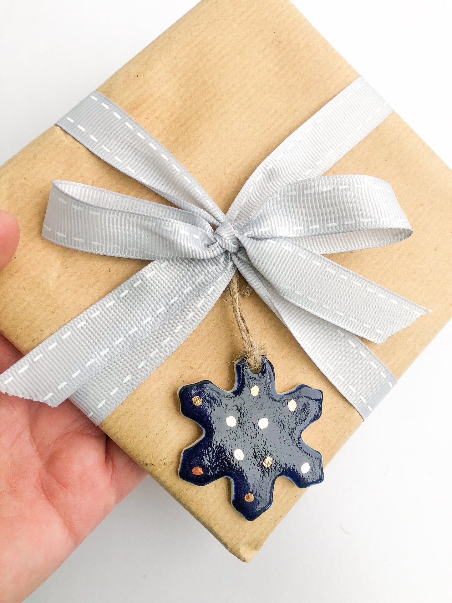 Ultramarine snowflake gift tag with gold dots