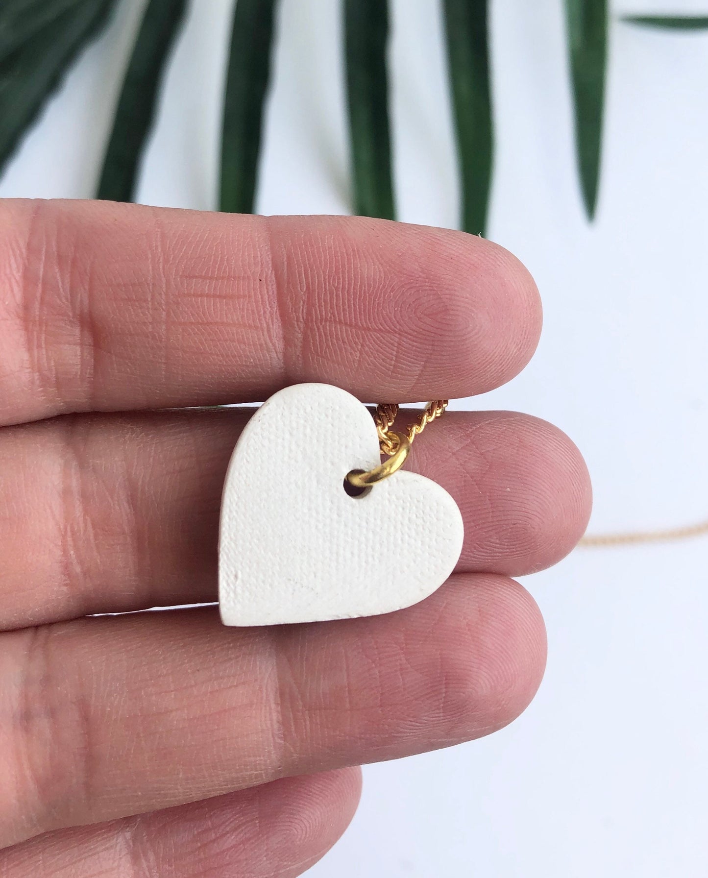 White large heart necklace with gold tip