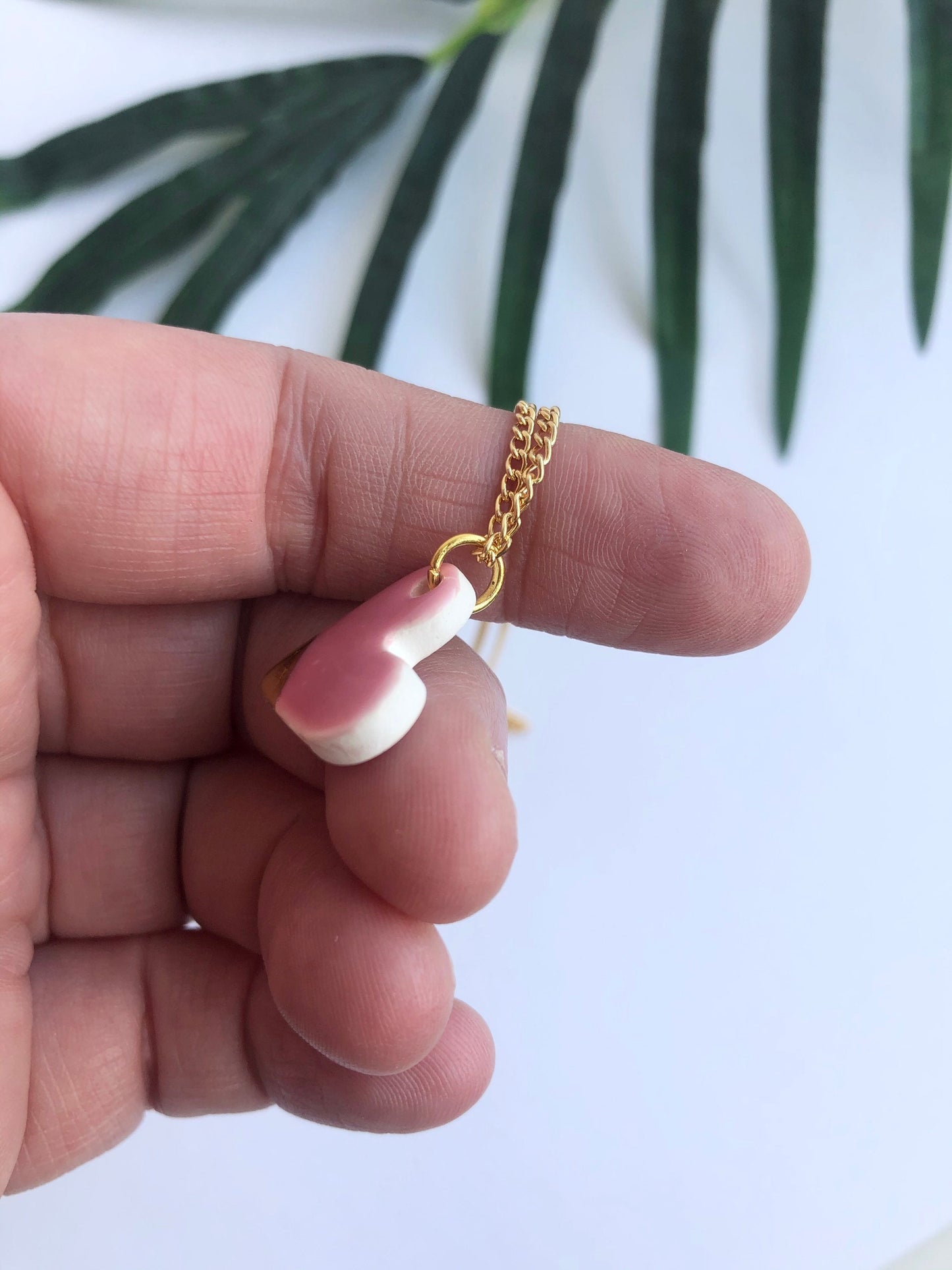 Pink small heart necklace with a gold tip