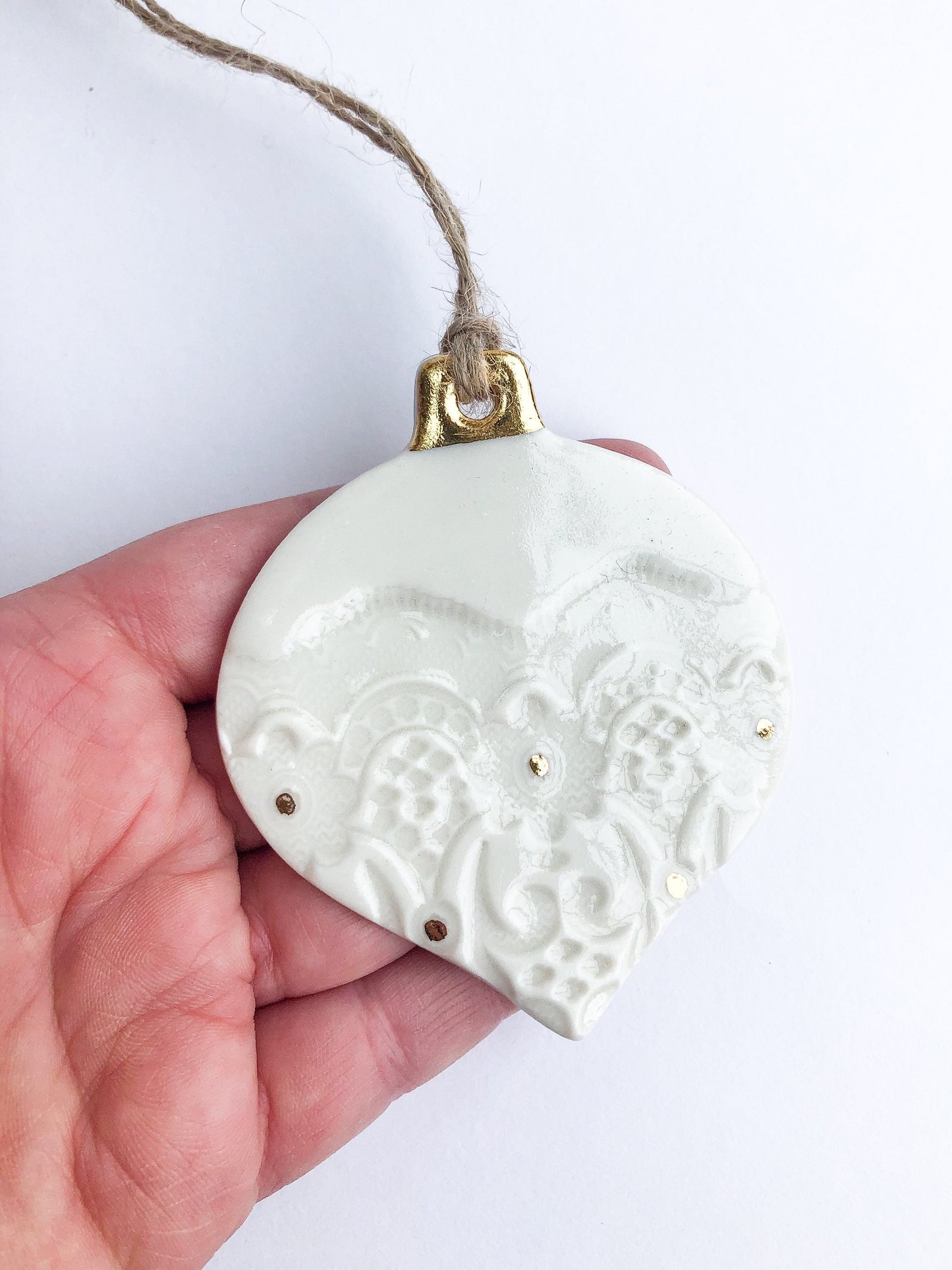 White bauble with gold detail and dots ornament