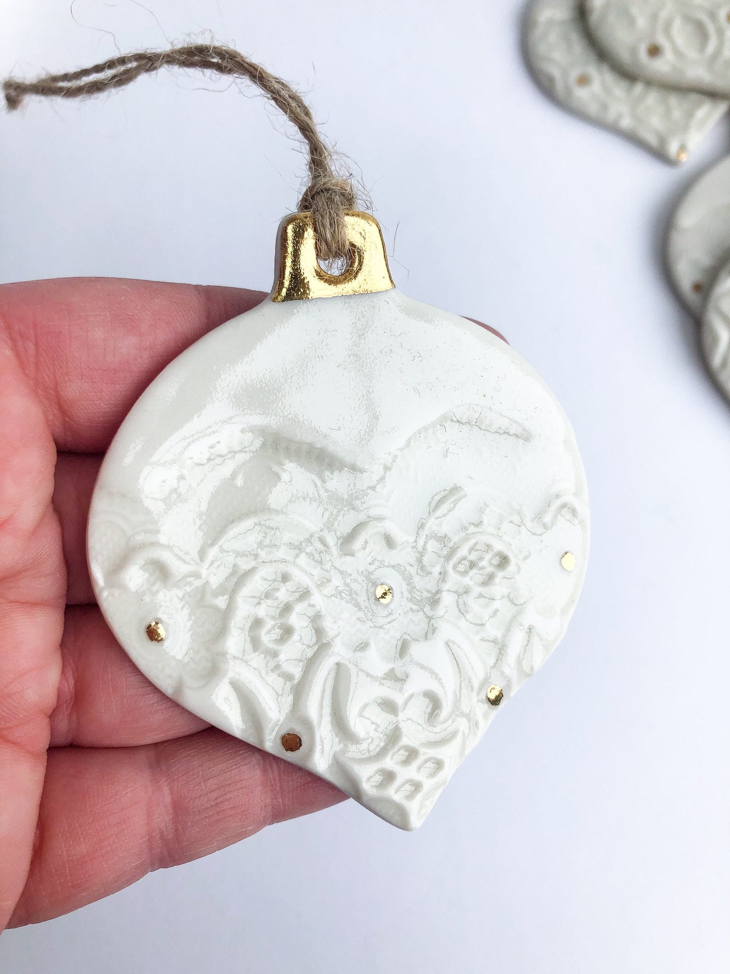 White bauble with gold detail and dots ornament