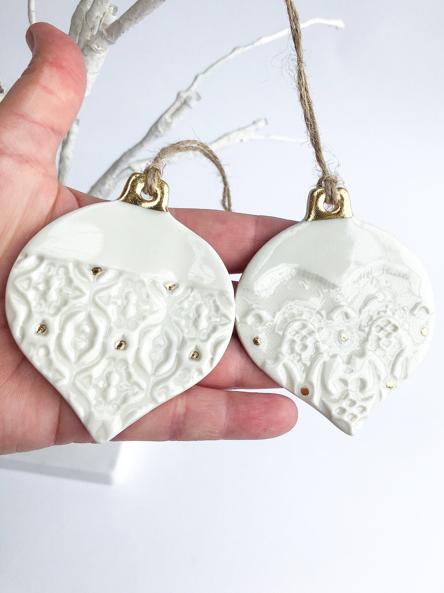 White bauble with gold detail and dots ornament