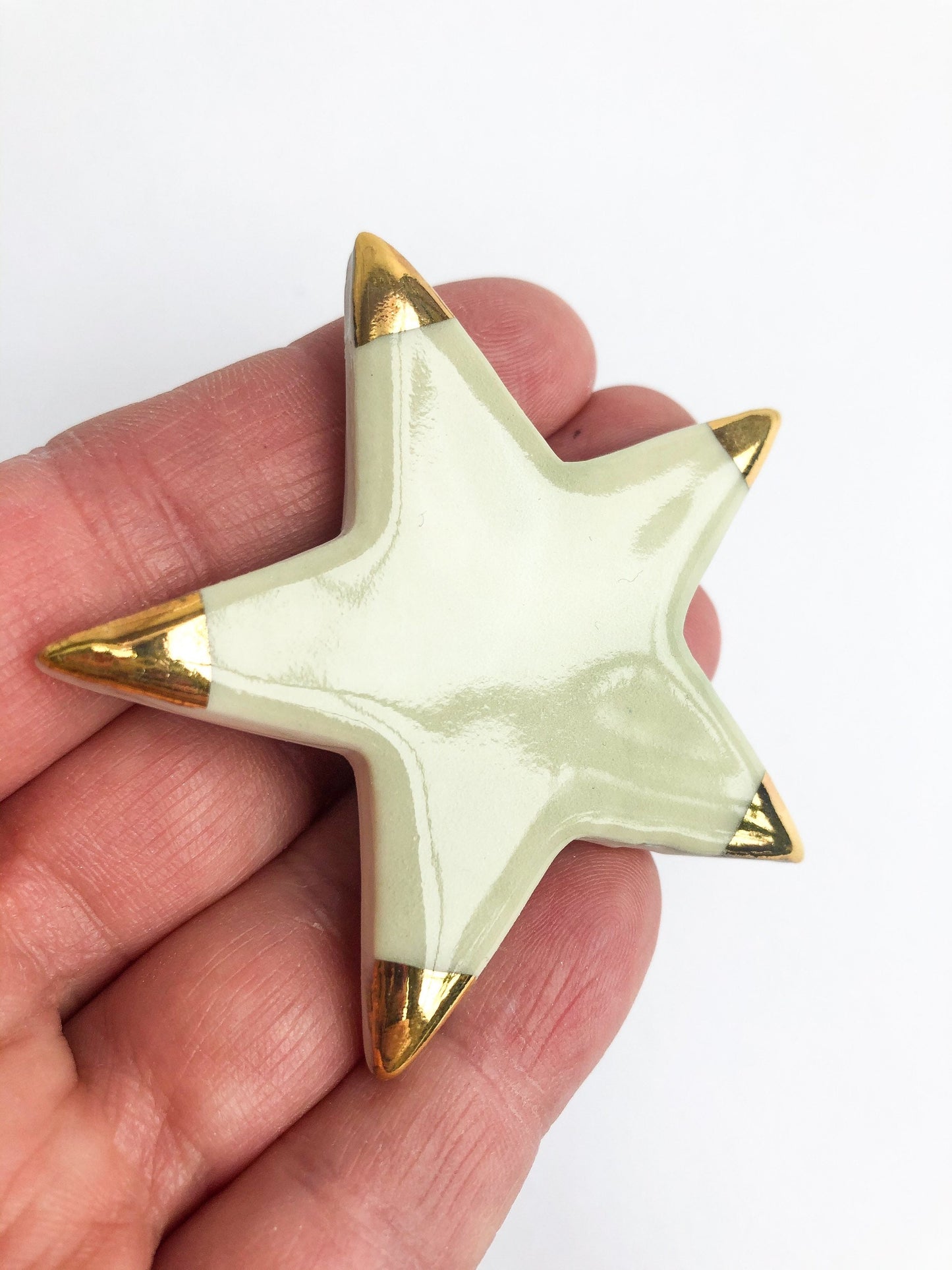 Magnet green star with gold tips