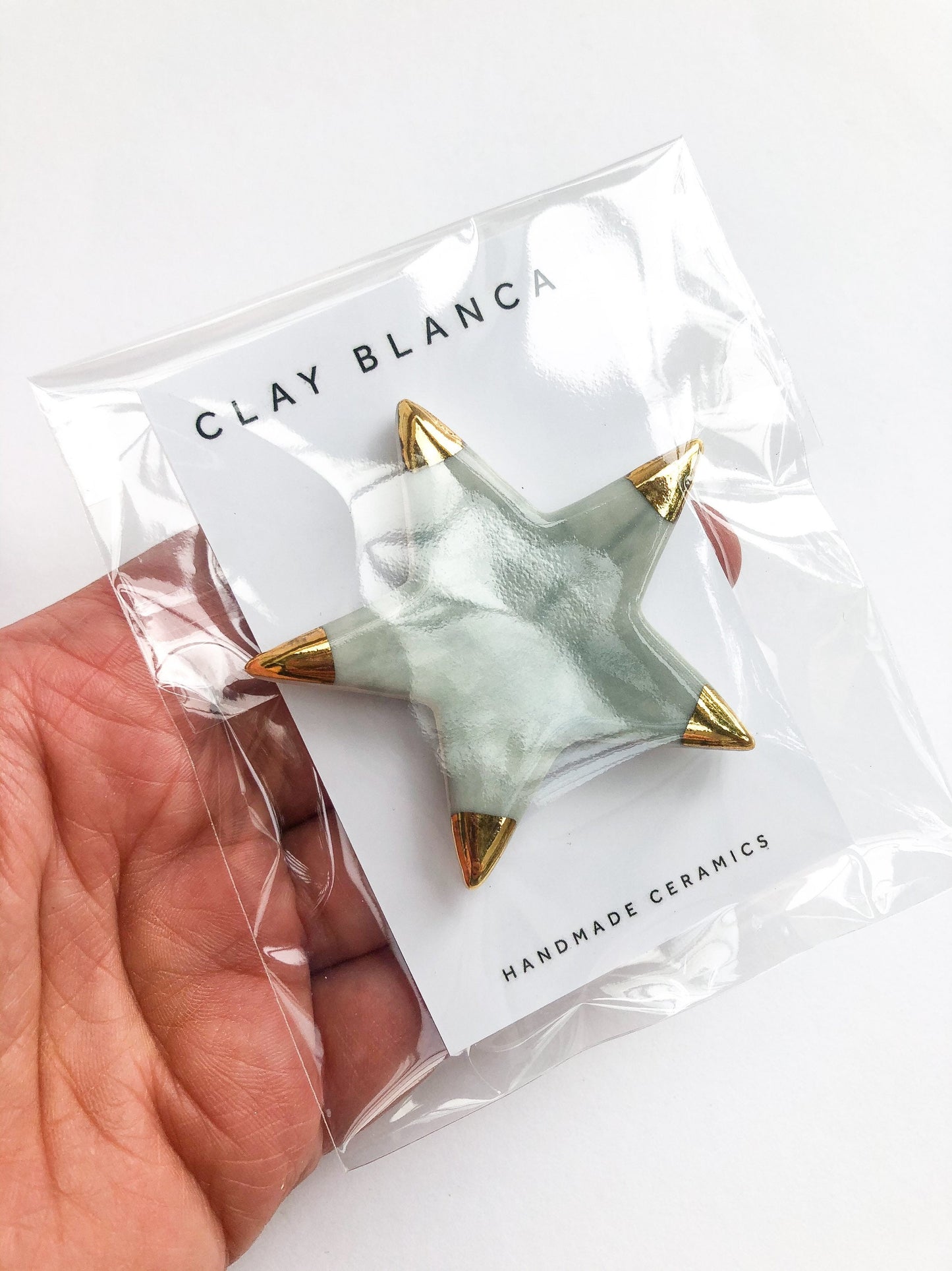 Magnet grey star with gold tips