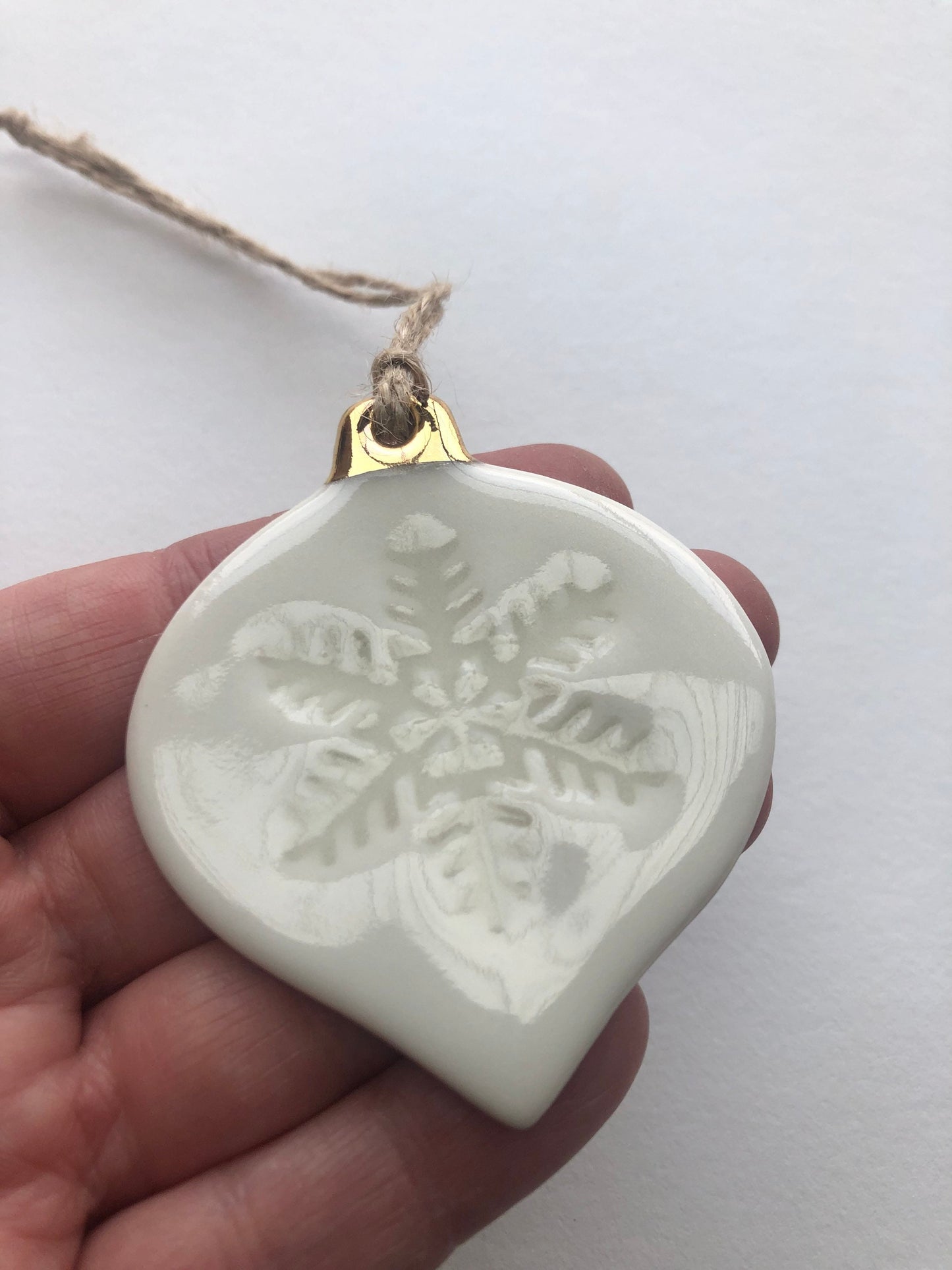 White Christmas bauble with snowflake imprint ornament
