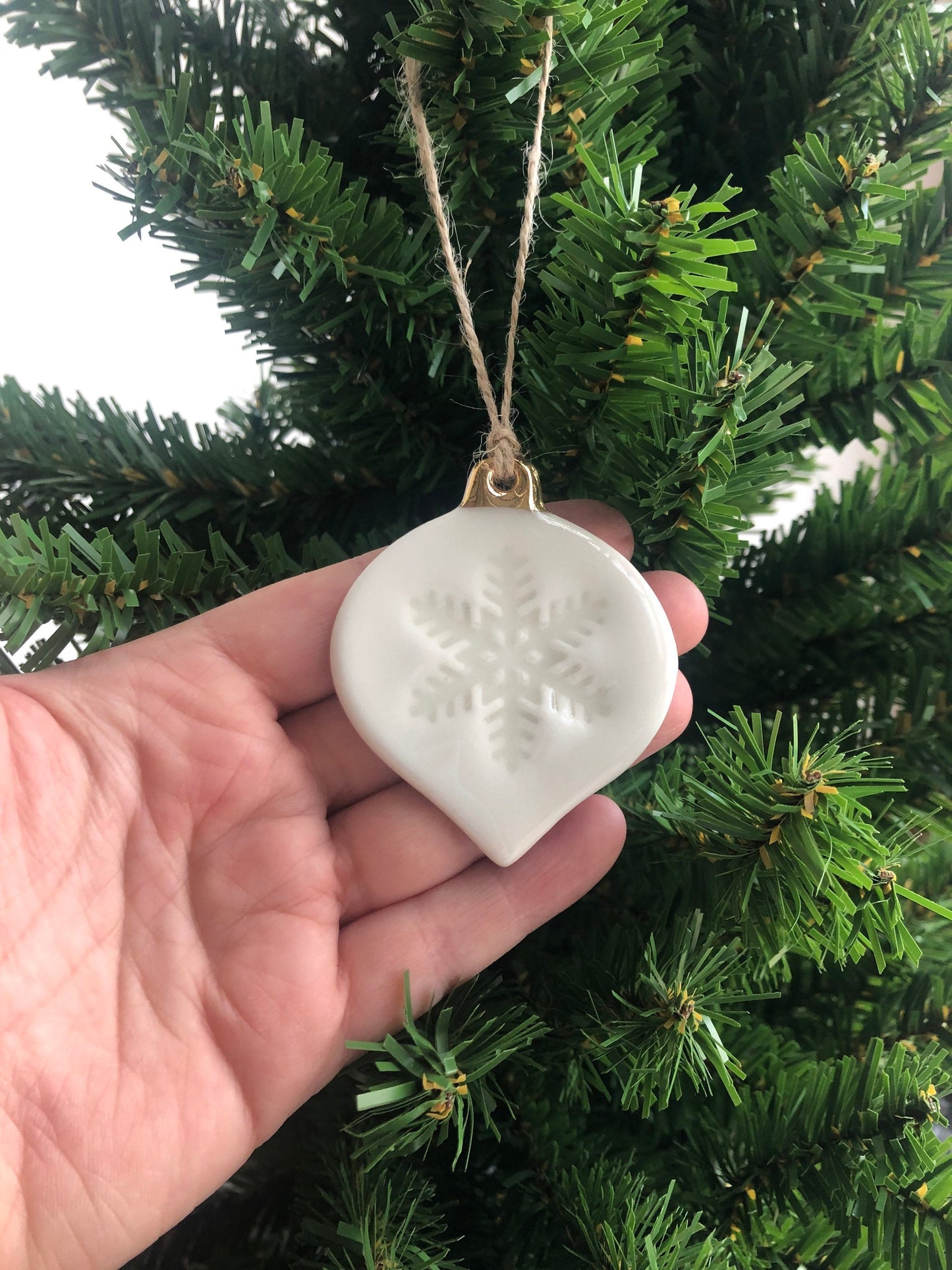 White Christmas bauble with snowflake imprint ornament