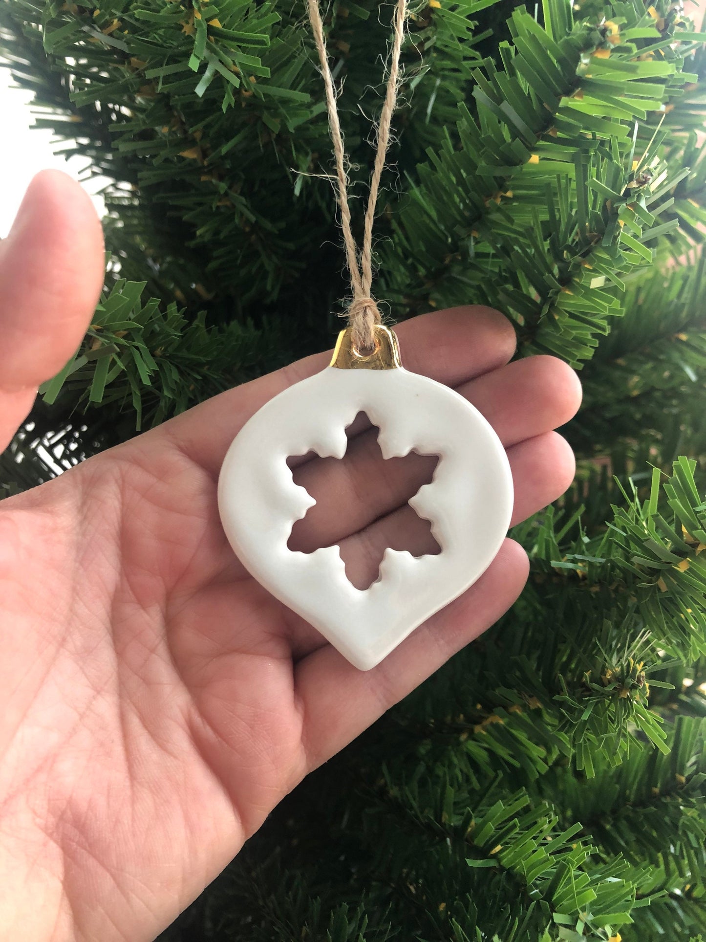 White Christmas bauble with snowflake cut-out ornament