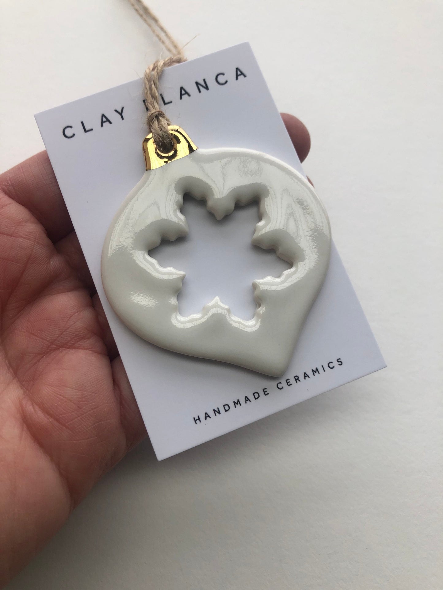 White Christmas bauble with snowflake cut-out ornament