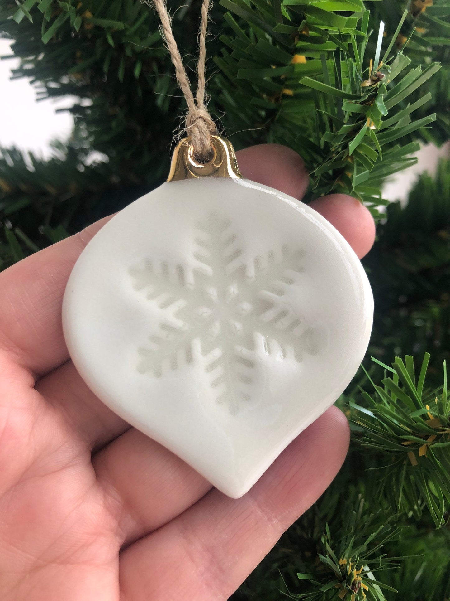 White Christmas bauble with snowflake imprint ornament