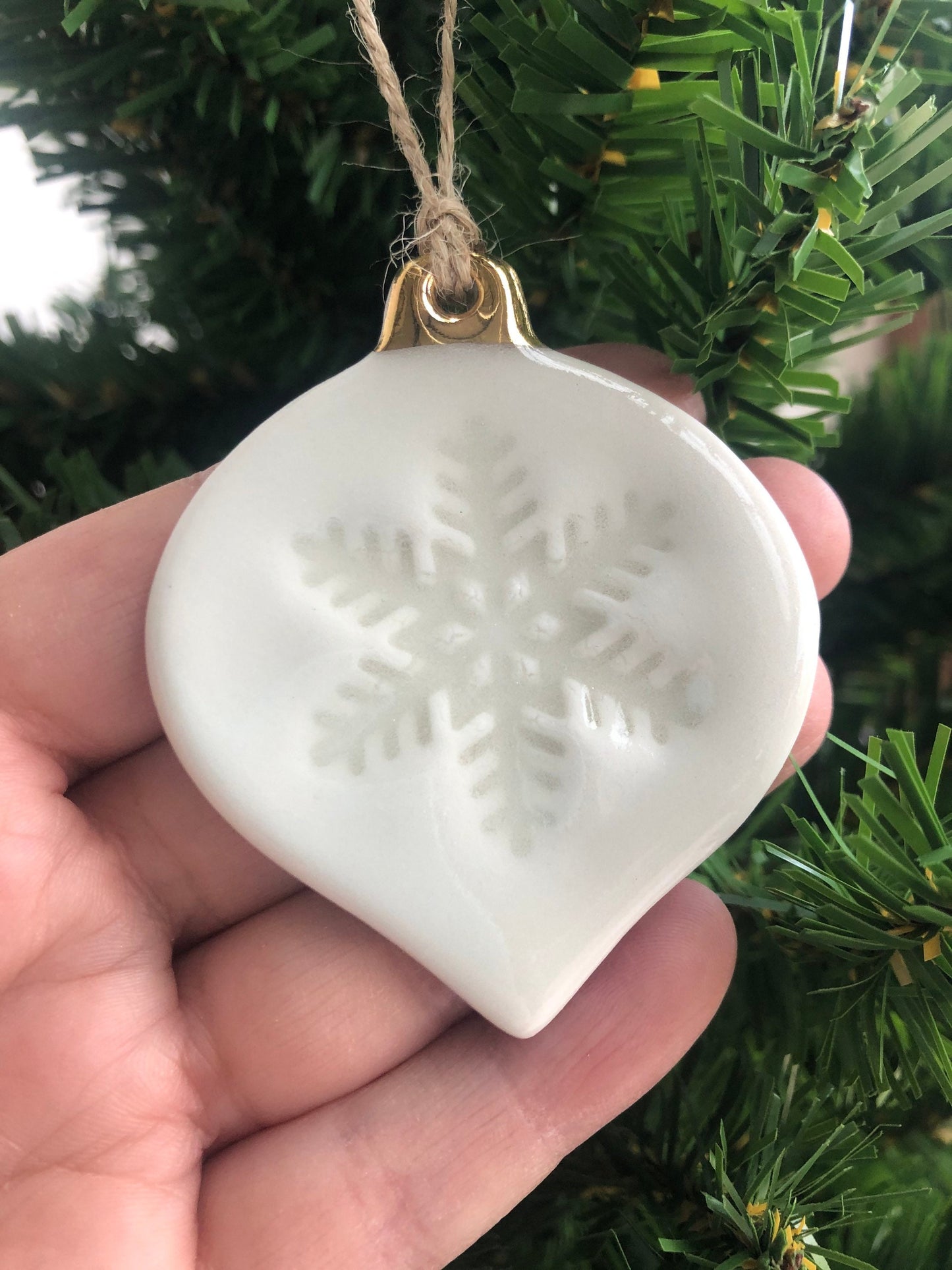 White Christmas bauble with snowflake imprint ornament