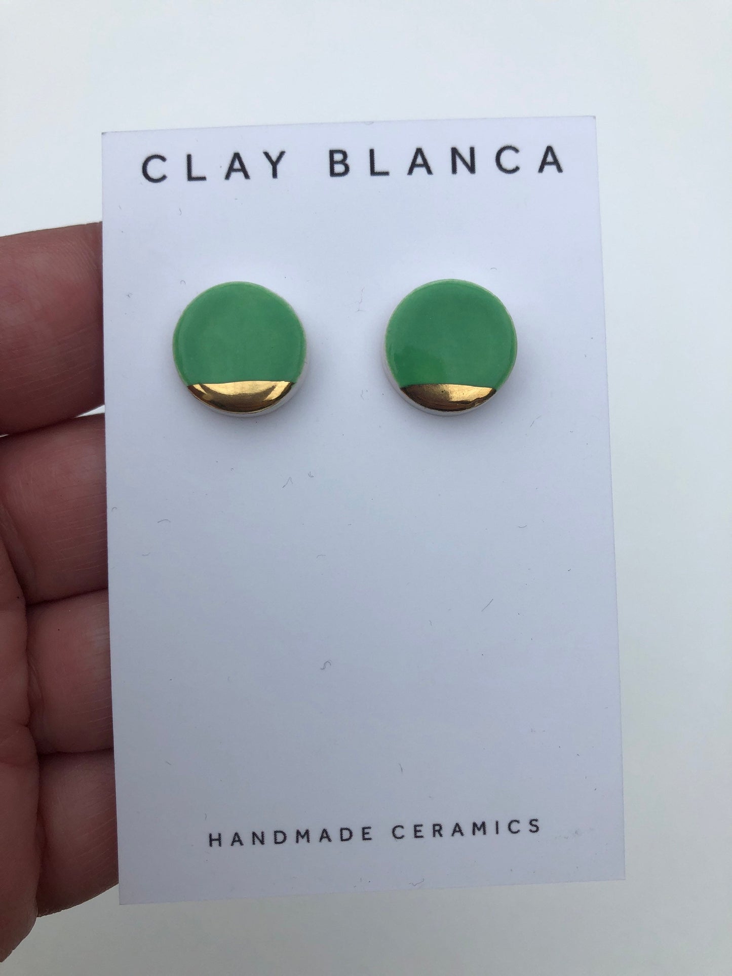 Betty green round studs with gold tips