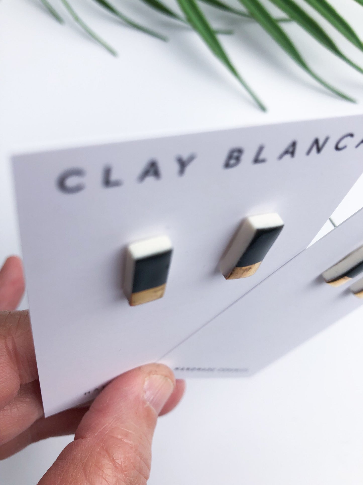 Black and gold porcelain rectangular studs