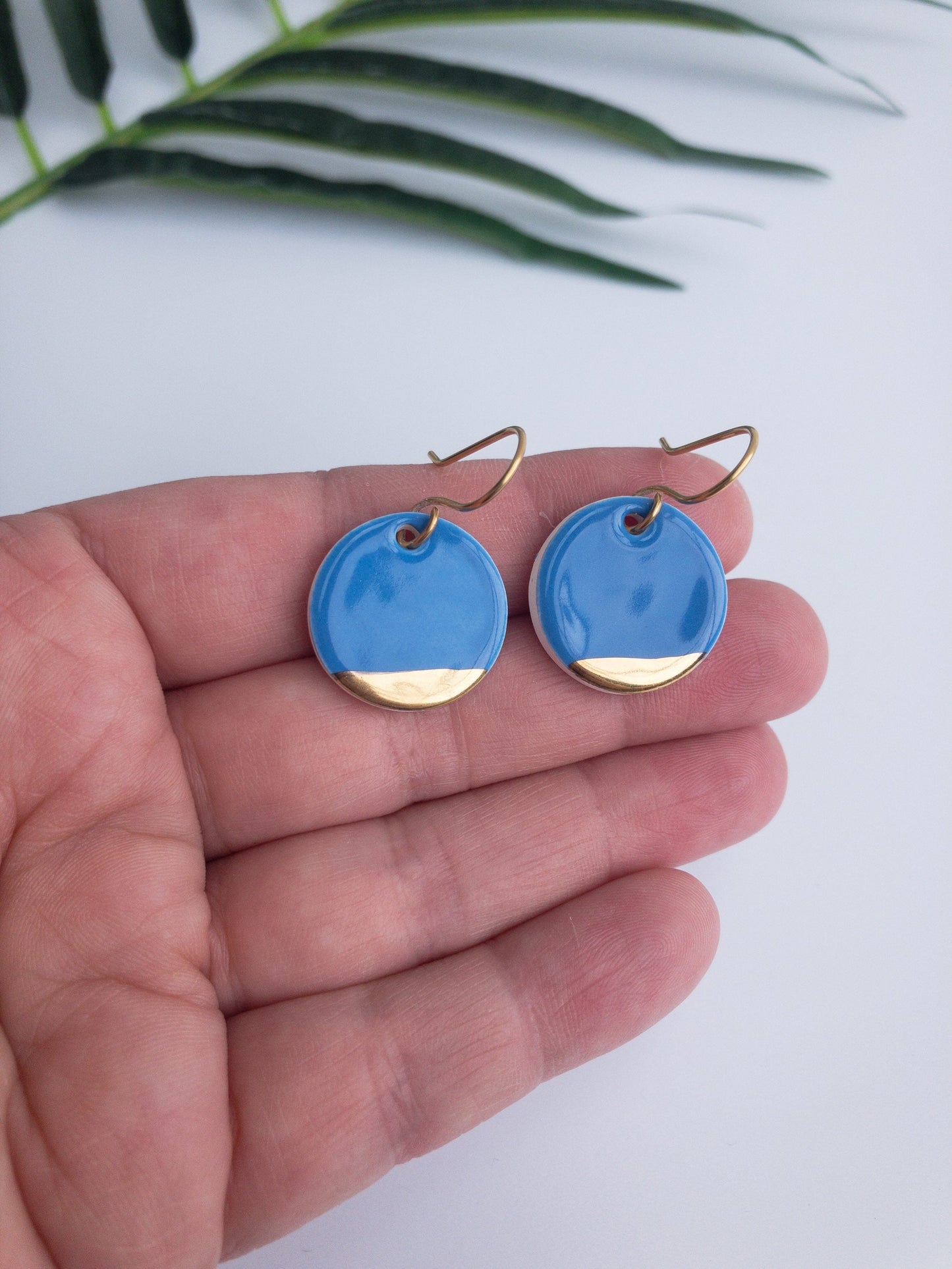 Carolina blue round dangles with gold tips