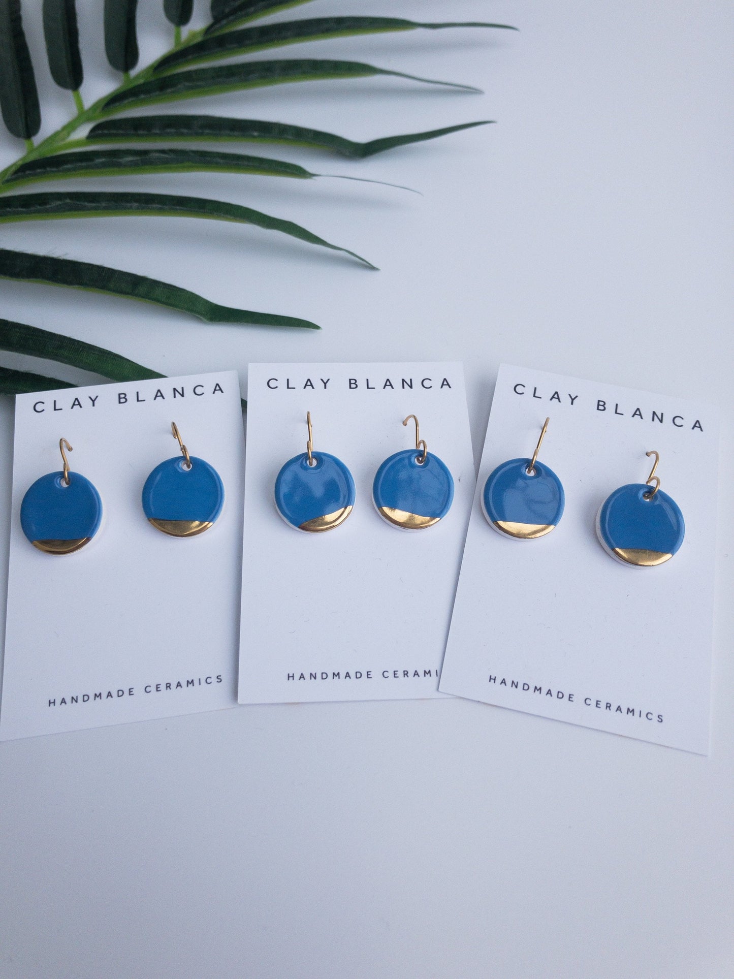 Carolina blue round dangles with gold tips