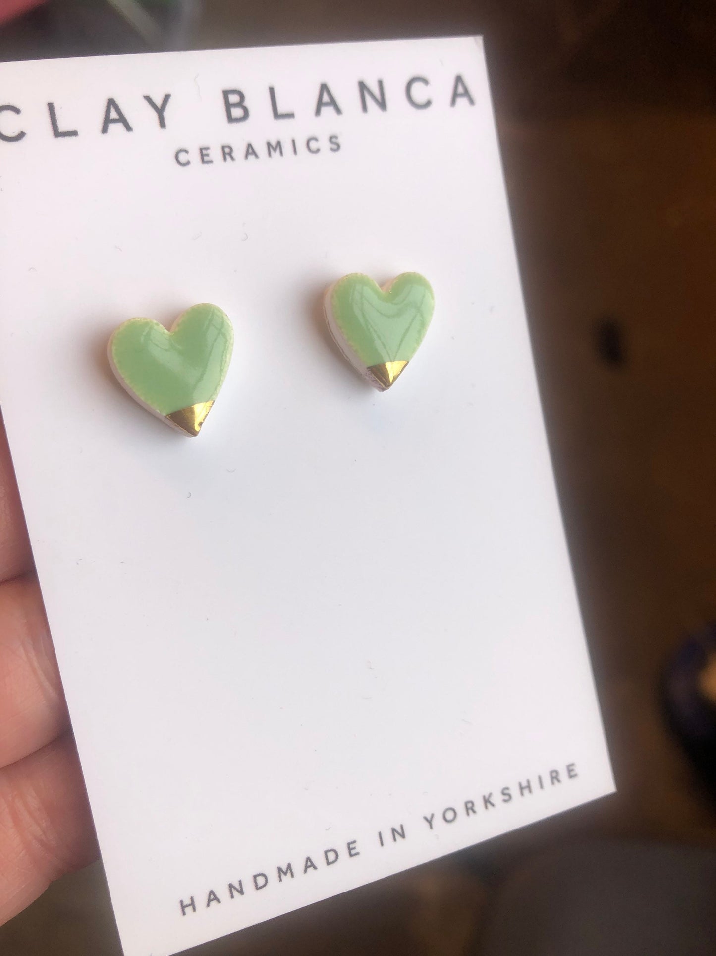 Light Green heart studs with gold tips