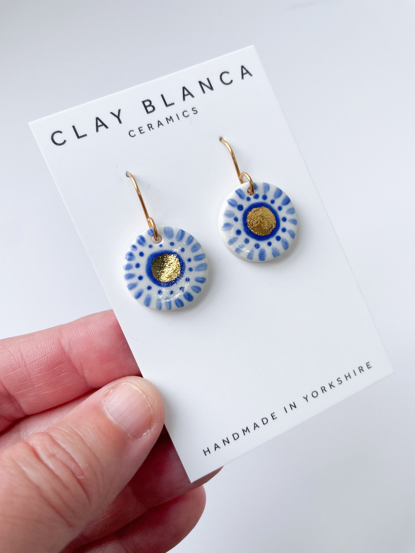 Hand painted blue and white with gold lustre dangles