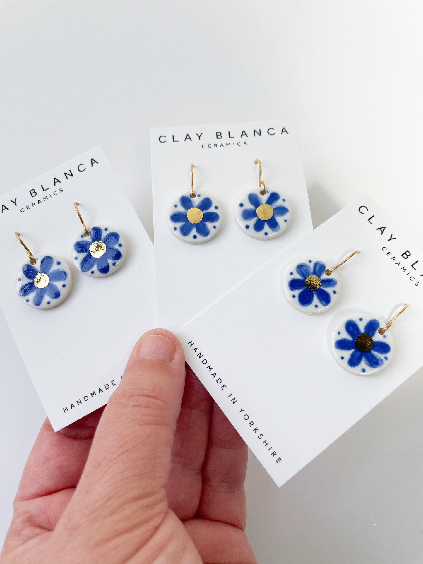 Hand painted blue flower with gold detail dangles