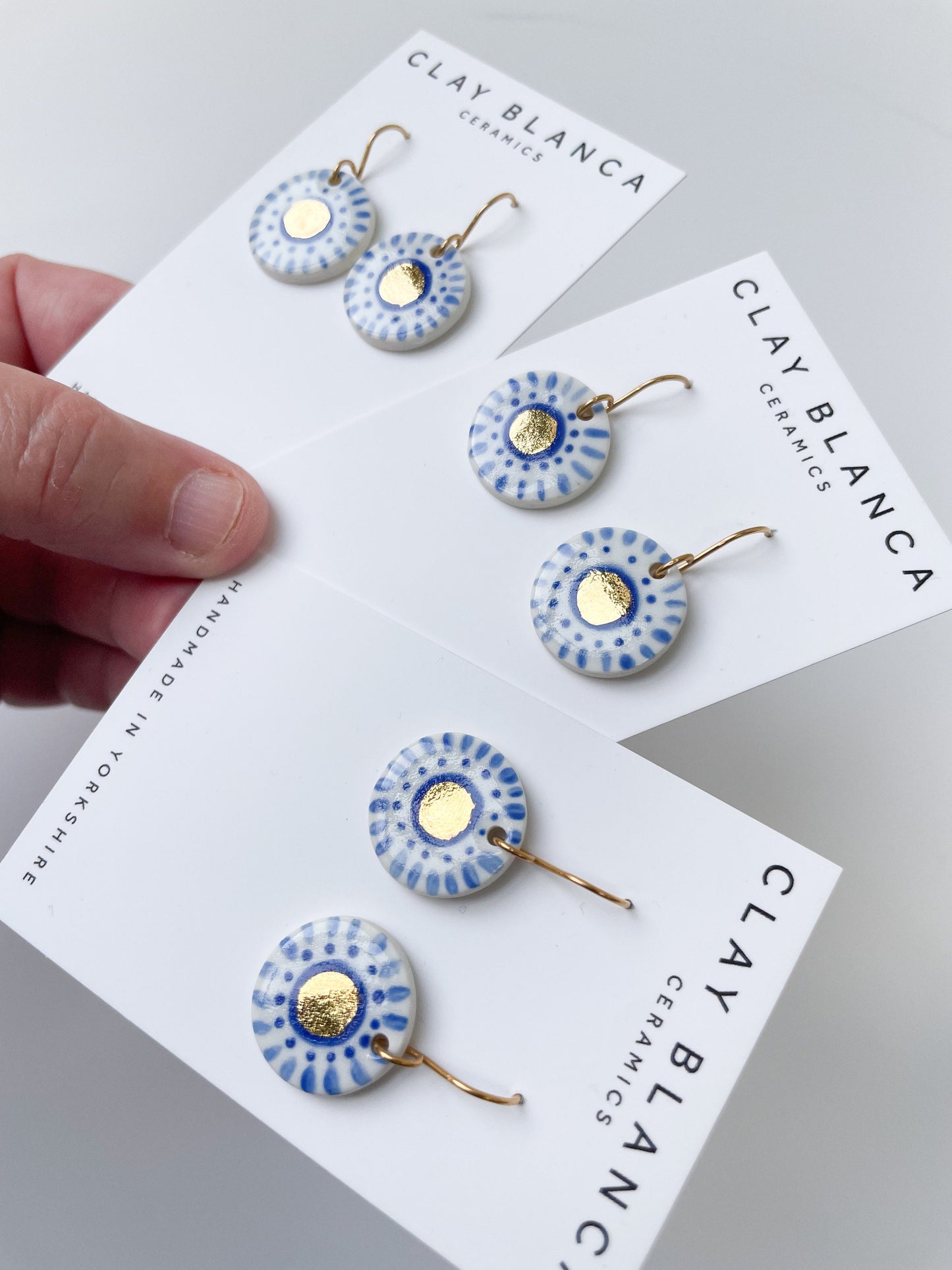 Hand painted blue and white with gold lustre dangles