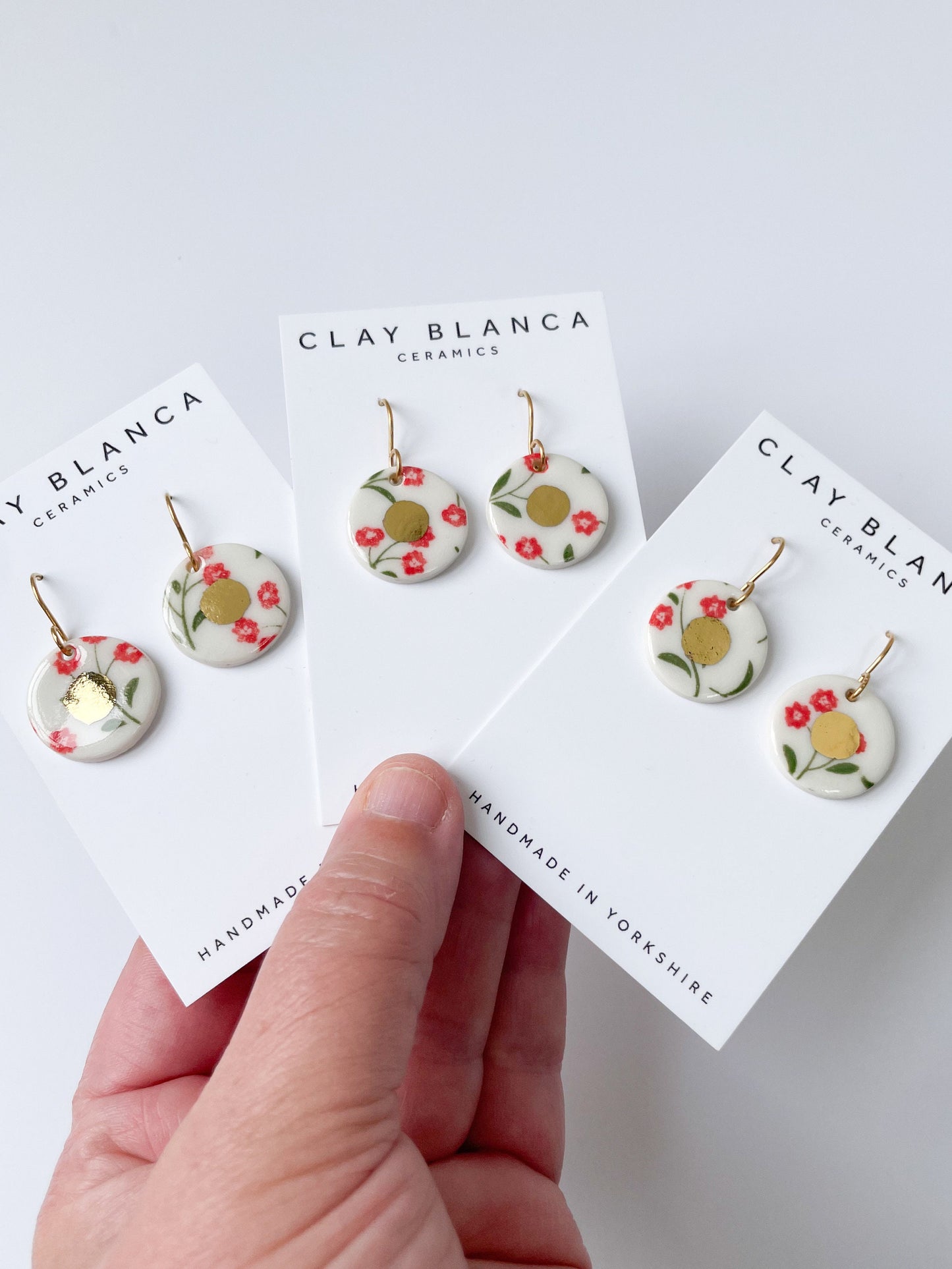 White and red flower pattern with gold centre dangles