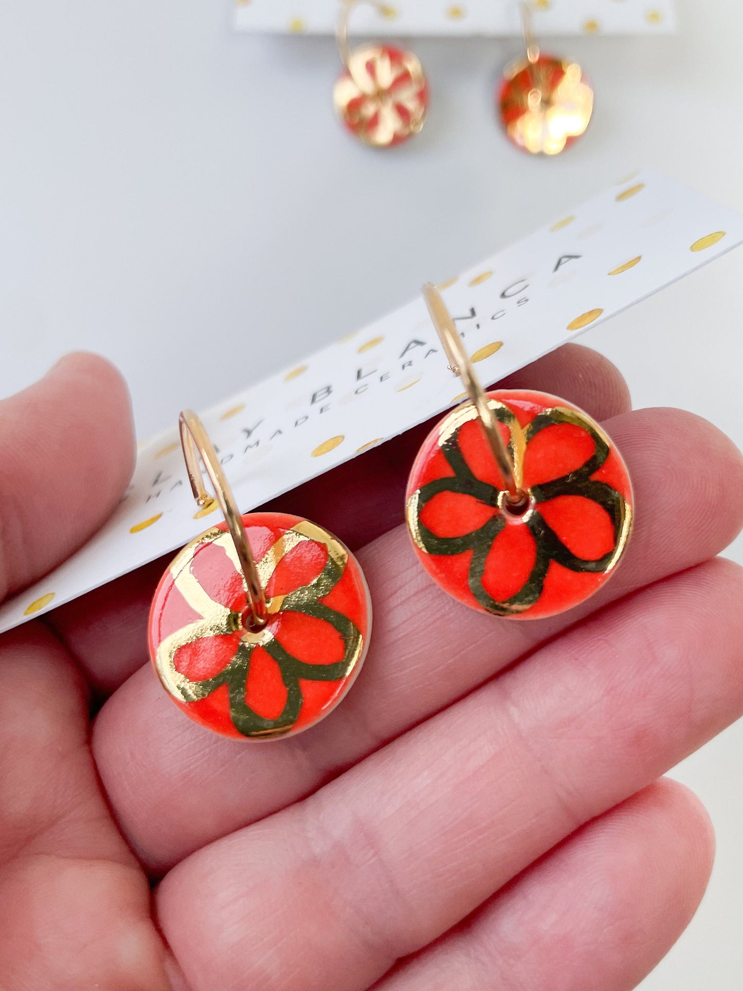 Vibrant Orange with gold flower design on large hoops