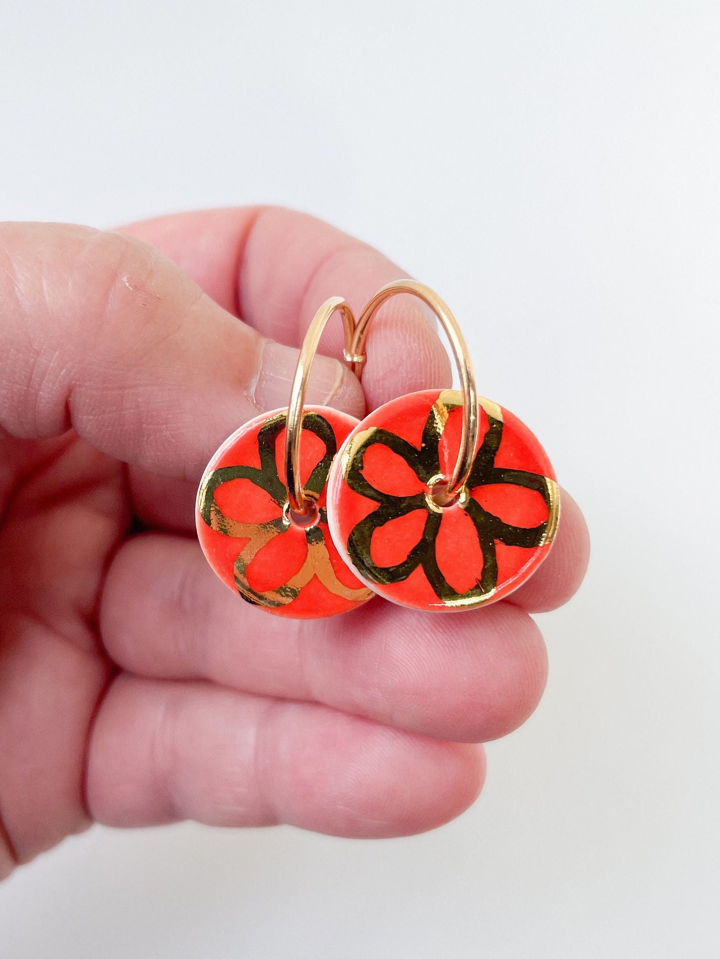 Vibrant Orange with gold flower design on large hoops