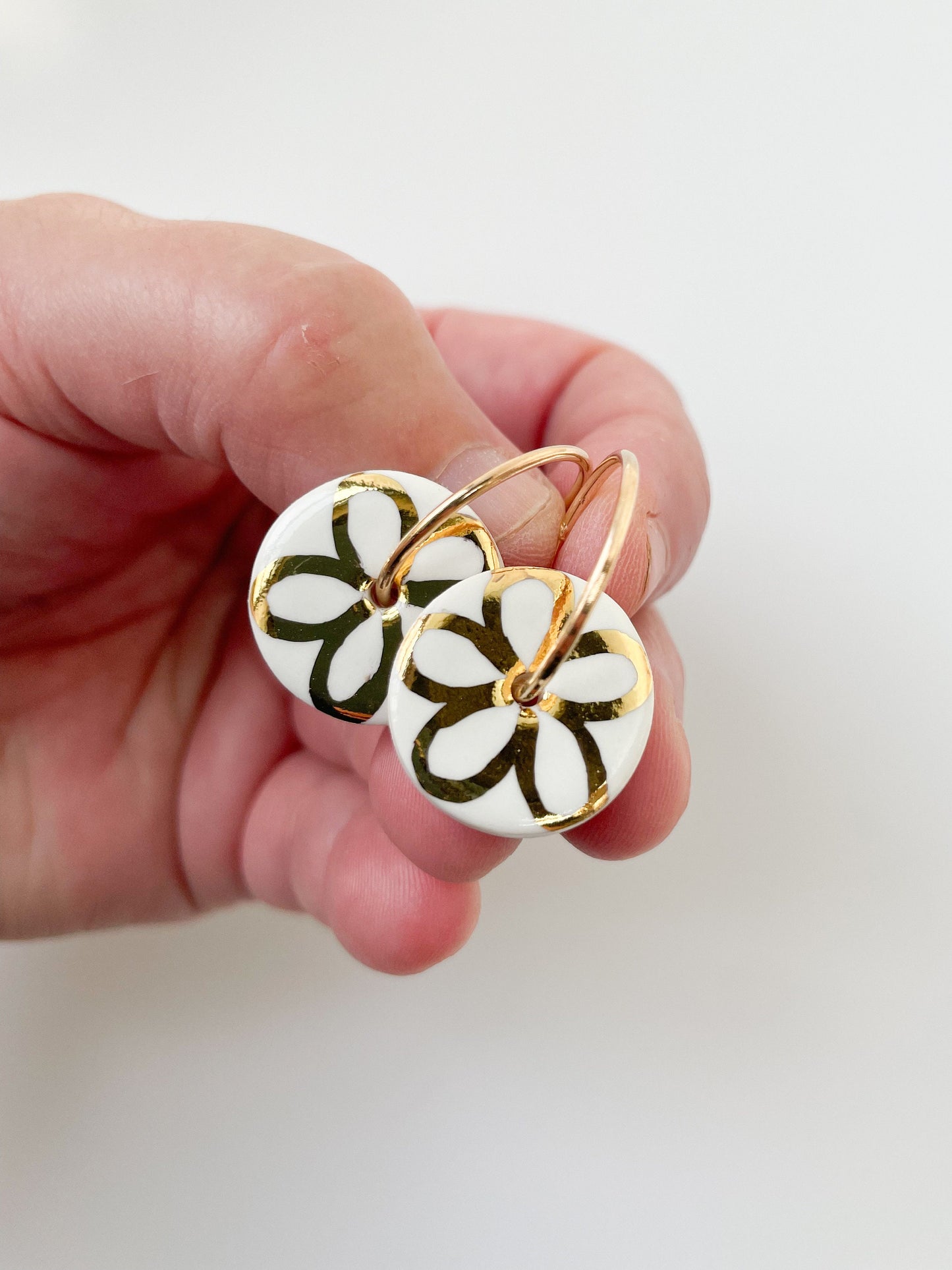 White with gold flower design on large hoops