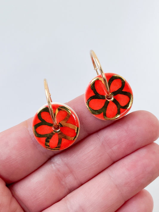 Round Vibrant Orange earring with hand painted gold flower, porcelain earrings on large gold plated hoops